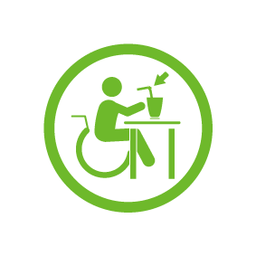 책상에 빨대컵을 놓고 음료를 마시는 휠체어 이용자의 모습이 표현된 픽토그램